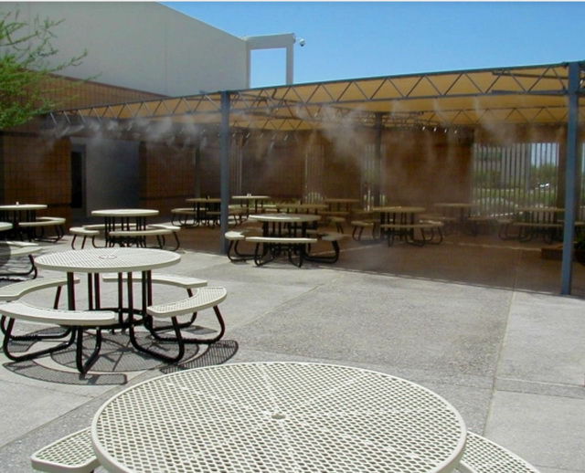 Misting line cooling a school's outdoor lunch area