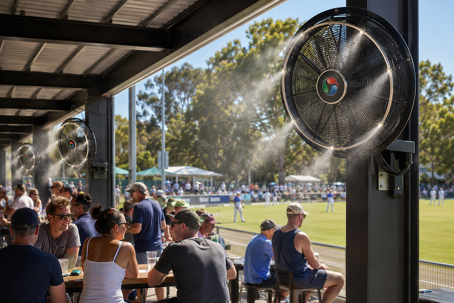 Misting fans cooling spectators in an undercover area at a sporting ground